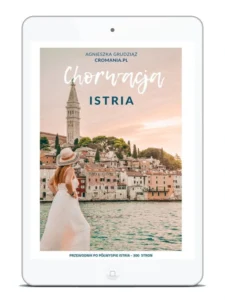 Przewodnik e-book Chorwacja Istria autorstwa Agnieszki Grudziąż. Okładka przedstawia panoramę starego miasta Rovinj z dzwonnicą kościoła św. Eufemii i kobietę w białej sukience.