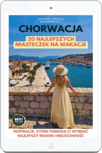 Okładka e-booka „Chorwacja. 20 najlepszych miasteczek na wakacje” Agnieszki Grudziąż (Cromania.pl / HelloCroatia.pl) na ekranie tabletu, przedstawiająca kobietę w kapeluszu patrzącą na nadmorskie miasteczko.