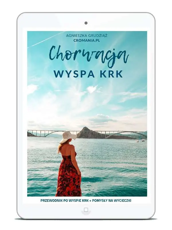 Przewodnik e-book Chorwacja: Wyspa Krk. Autorka Agnieszka Grudziąż (Cromania.pl / HelloCroatia.pl). Na okładce Most Krcki łączący wyspę z lądem, turkusowe morze i kobieta w czerwonej sukience.